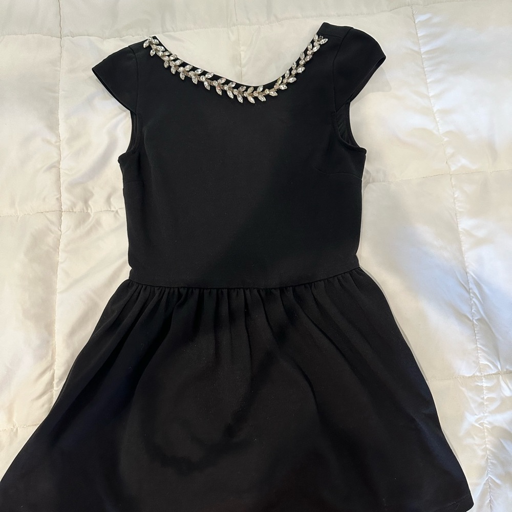Black short dress with jewels on neck by Chelsea and Violet